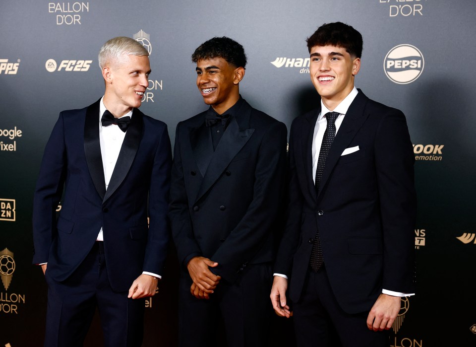 three men in tuxedos are standing in front of a wall that says ballon d' or