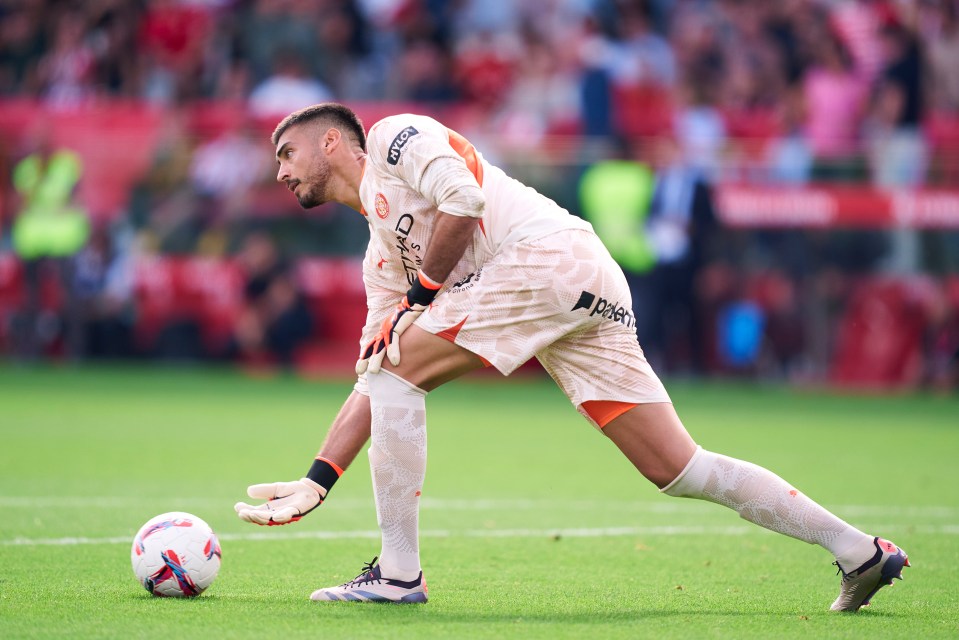 a soccer player wearing a jersey that says ' etihad ' on it