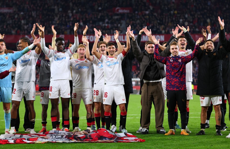 Sevilla FC players applaud after a match.