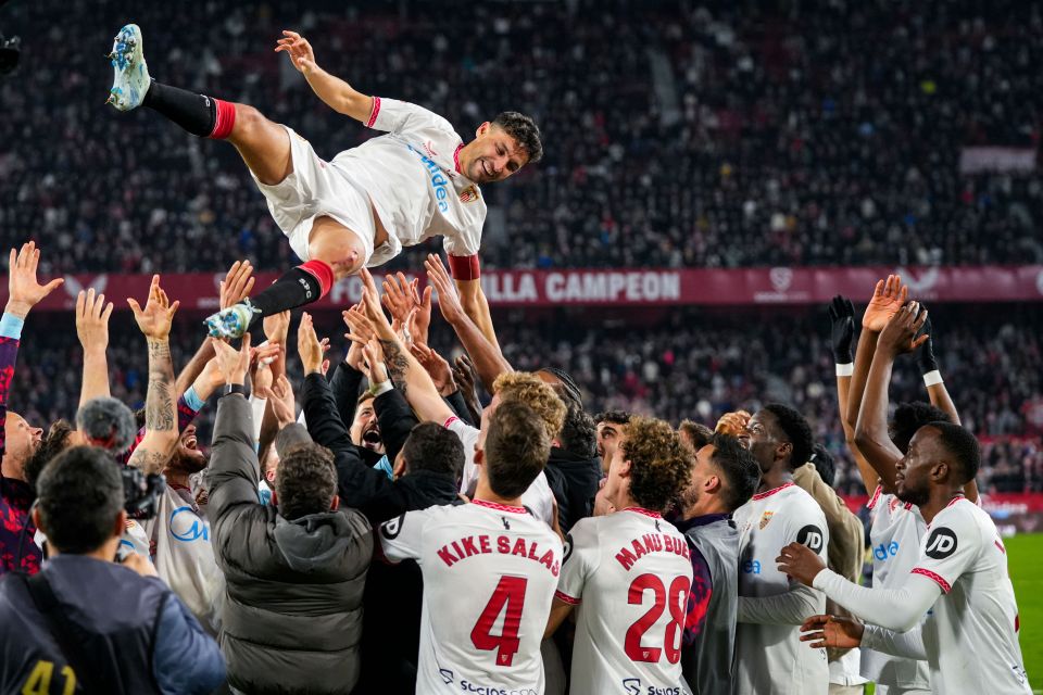 Sevilla FC teammates celebrate Jesús Navas' final professional game.