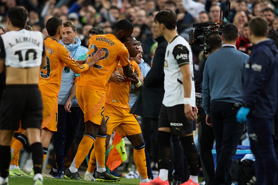 Real Madrid players react during a soccer match.