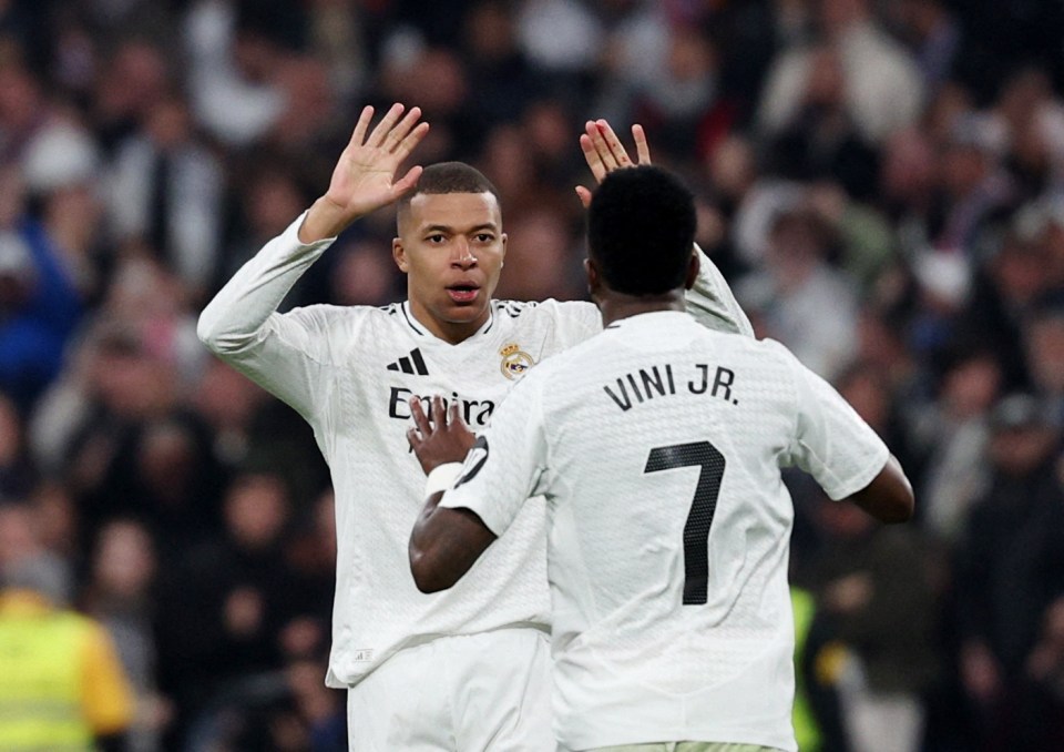 Kylian Mbappé and Vinicius Junior celebrating a goal.