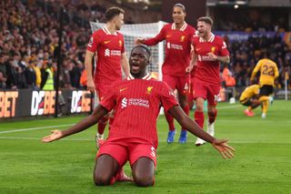 Ibrahima Konate of Liverpool celebrates scoring the first goal during the Premier League match between Wolverhampton Wanderers FC and Liverpool FC at Molineux on September 28, 2024 in Wolverhampton, England.