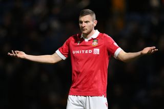 Paul Mullin of Wrexham gestures during the Sky Bet League One match between Stockport County FC and Wrexham AFC at Edgeley Park on November 16, 2024 in Stockport, England.