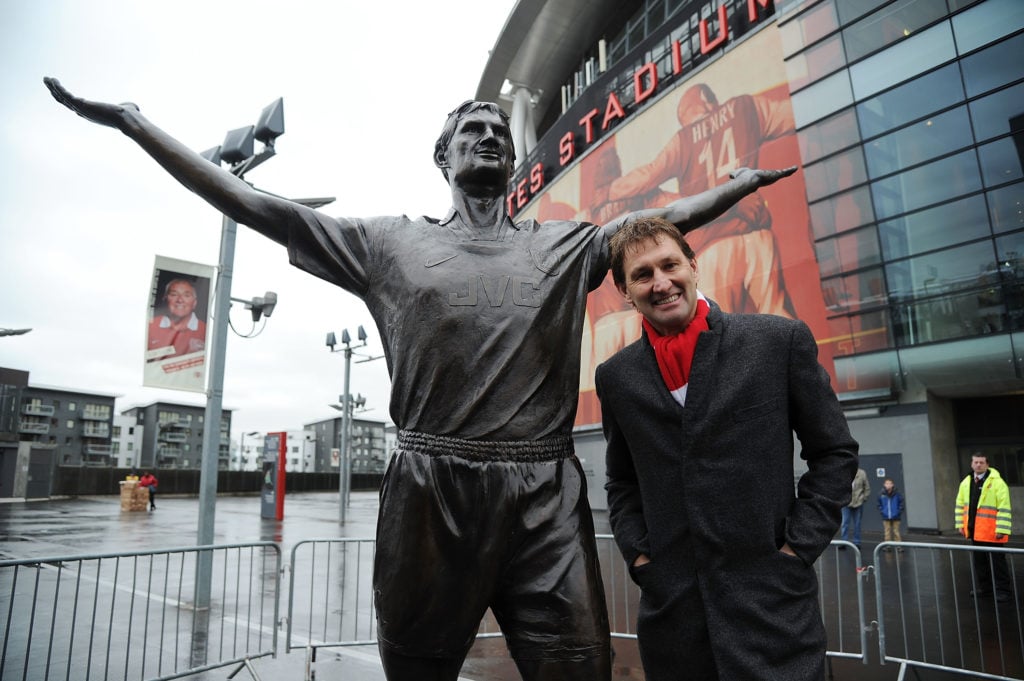 Arsenal legend Tony Adams poses beside the recently installed statue of himself at Emirates Stadium before the Barclays Premier League match betwee...