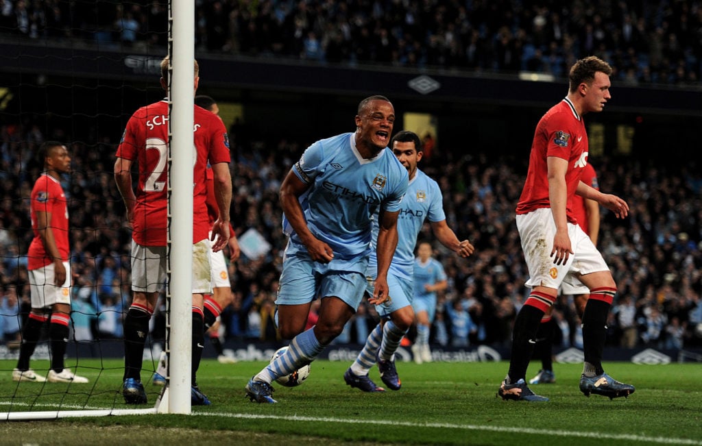 Vincent Kompany of Manchester City celebrates scoring the opening goal during the Barclays Premier League match between Manchester City and Manches...