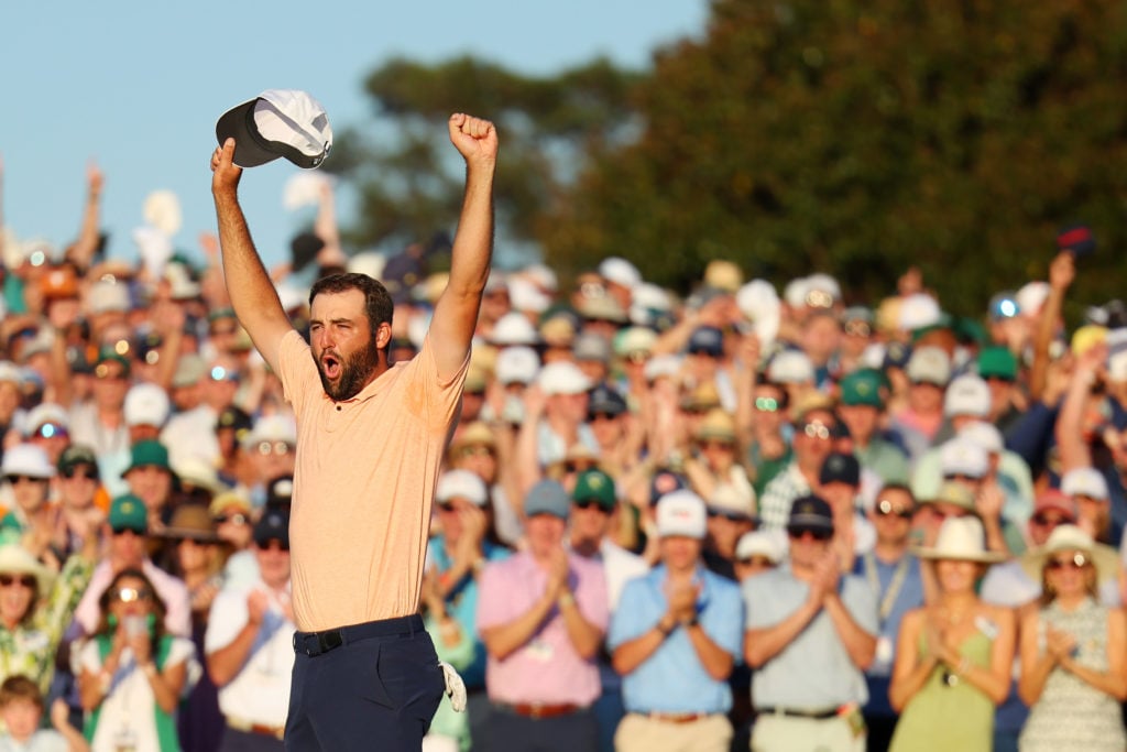 Scottie Scheffler of the United States celebrates on the 18th green after winning the 2024 Masters Tournament at Augusta National Golf Club on Apri...