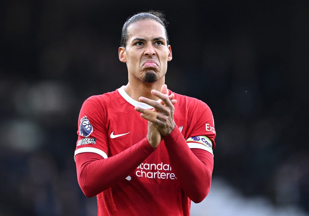 Virgil van Dijk of Liverpool applauds the fans after the team's victory in the Premier League match between Fulham FC and Liverpool FC at Craven Co...