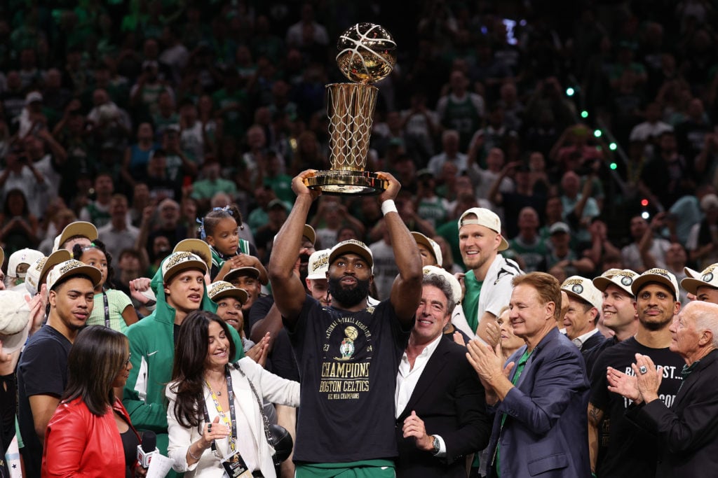 Jaylen Brown #7 of the Boston Celtics holds up the Larry O'Brien trophy after Boston's 106-88 win against the Dallas Mavericks in Game Five of the ...