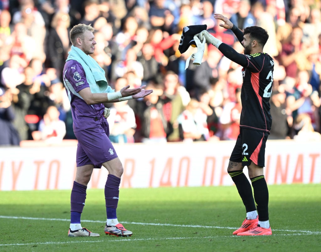 (R) Arsenal goalkeeper David Raya with Southampton goalkeeper Aaron Ramsdale after the Premier League match between Arsenal FC and Southampton FC a...