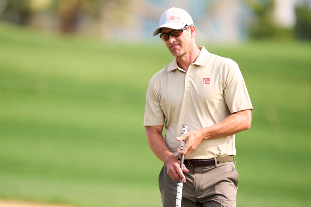 Adam Scott of Australia reacts after missing a putt on the 7th hole during the third round of the Hero Dubai Desert Classic at Emirates Golf Club o...