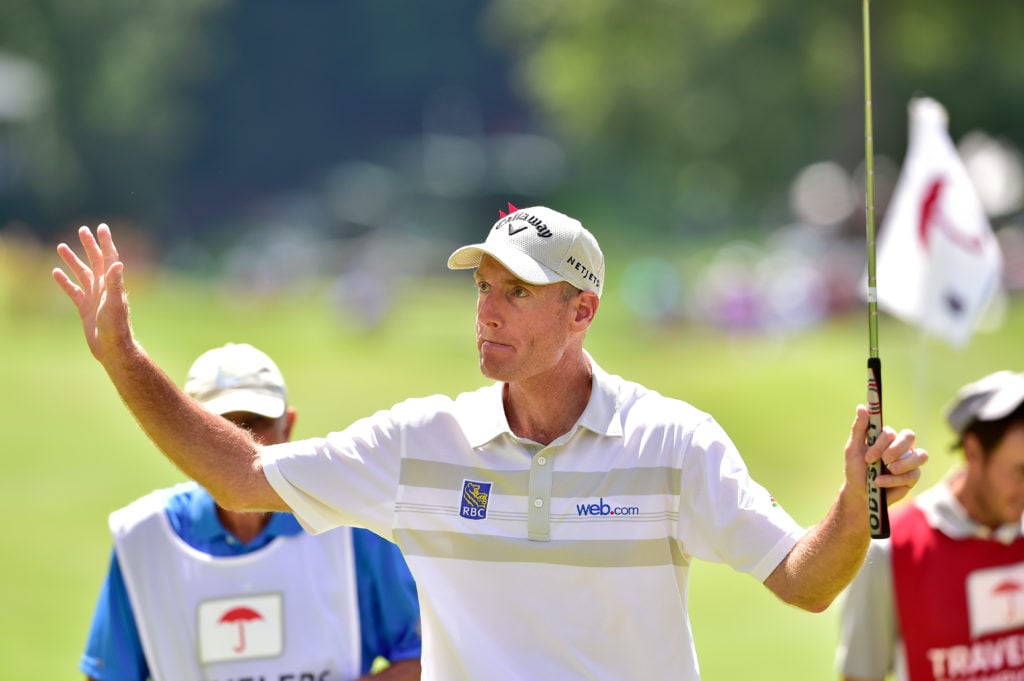 Jim Furyk of the United States celebrates after shooting a record setting 58 during the final round of the Travelers Championship at TCP River High...