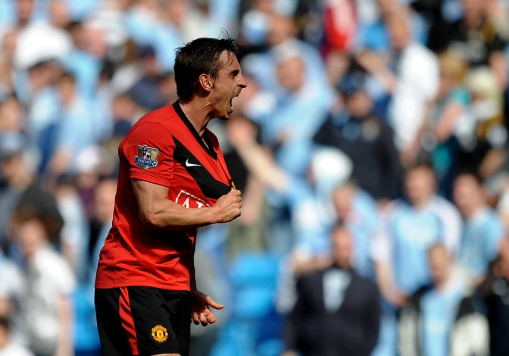 Gary Neville of Manchester United celebrates at the end of  the Barclays Premier League match between Manchester City and Manchester United at the ...