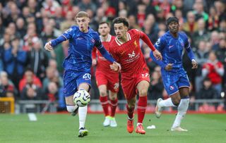 LIVERPOOL, ENGLAND - OCTOBER 20: Liverpool's Curtis Jones battles with Chelsea's Cole Palmer during the Premier League match between Liverpool FC and Chelsea FC at Anfield on October 20, 2024 in Liverpool, England. (Photo by Alex Dodd - CameraSport via Getty Images)