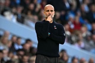 Manchester City's Spanish manager Pep Guardiola looks on from the sidelines during the English Premier League football match between Manchester City and Southampton at the Etihad Stadium in Manchester, north west England, on October 26, 2024. (Photo by Oli SCARFF / AFP) / RESTRICTED TO EDITORIAL USE. No use with unauthorized audio, video, data, fixture lists, club/league logos or 'live' services. Online in-match use limited to 120 images. An additional 40 images may be used in extra time. No video emulation. Social media in-match use limited to 120 images. An additional 40 images may be used in extra time. No use in betting publications, games or single club/league/player publications. / (Photo by OLI SCARFF/AFP via Getty Images)