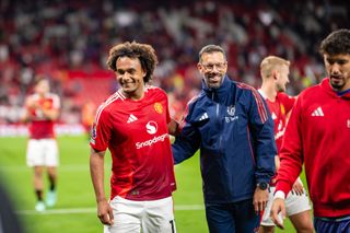 MANCHESTER, ENGLAND - AUGUST 16: Joshua Zirkzee of Manchester United reacts to Ruud van Nistelrooy at the end of the Premier League match between Manchester United FC and Fulham FC at Old Trafford on August 16, 2024 in Manchester, United Kingdom. (Photo by Ash Donelon/Manchester United via Getty Images)