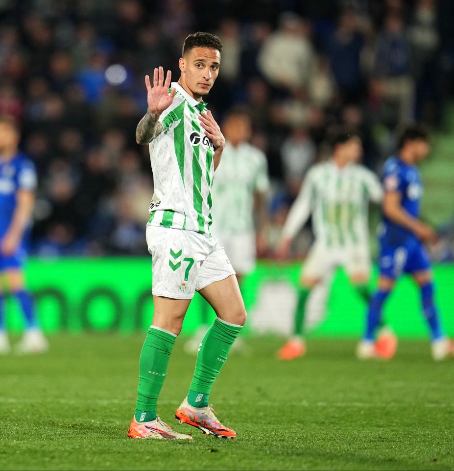 Real Betis player Antony leaving the pitch after a red card.