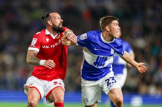 Steven Fletcher of Wrexham and Alfons Sampsted of Birmingham City challenge for the ball during the EFL League One match at St Andrew's on September 16, 2024