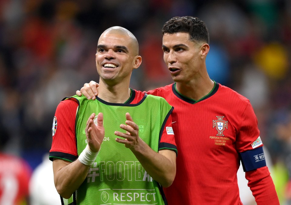 Pepe and Cristiano Ronaldo of Portugal celebrating a victory.