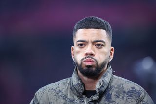 Leipzig's injured German defender #39 Benjamin Henrichs looks on during the German first division Bundesliga football match between RB Leipzig and Borussia Dortmund in Leipzig, eastern Germany on March 15, 2025.