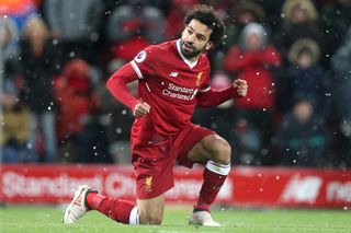 Mohamed Salah celebrates after scoring his fourth goal for Liverpool against Watford in March 2018.