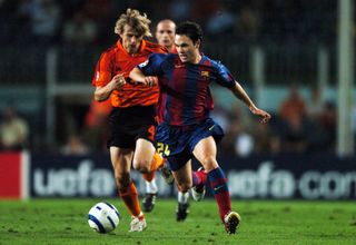 BARCELONA, SPAIN - SEPTEMBER 29: Andres Iniesta of Barcelona and Anatoliy Tymoshchuk of Shakhtar Donetsk compete for the ball during the UEFA Champions League Group F match between Barcelona and Shakhtar Donetsk at Camp Nou on September 29, 2004 in Barcelona, Spain. (Photo by Etsuo Hara/Getty Images)