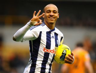 Peter Odemwingie celebrates his third goal for West Brom against Wolves in February 2012.