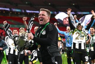 LONDON, ENGLAND - MARCH 16: Newcastle United head coach Eddie Howe celebrates with the trophy after during the Carabao Cup Final between Liverpool and Newcastle United at Wembley Stadium on March 16, 2025 in London, England. (Photo by Stu Forster/Getty Images)