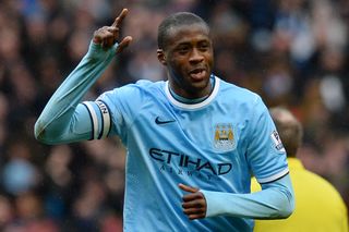 Yaya Toure celebrates his third goal for Manchester City against Fulham in March 2014.