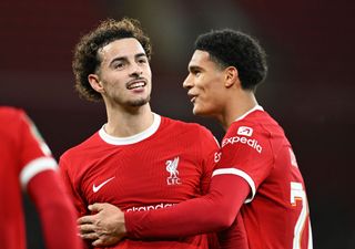 Curtis Jones of Liverpool celebrates with teammate Jarell Quansah