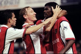 Nwankwo Kanu is congratulated by team-mates after scoring for Arsenal against Chelsea in October 1999.