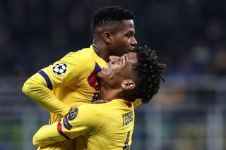 Ansu Fati celebrates with Jean-Clair Todibo after scoring for Barcelona against Inter in the Champions League in December 2019.