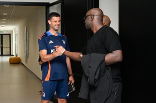 Khephren Thuram greets father Lilian Thuram at his unveiling as a Juventus player in July 2024.