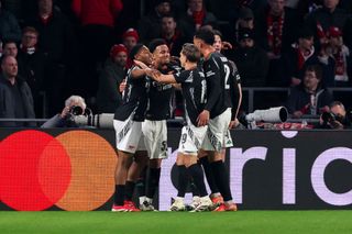 EINDHOVEN, NETHERLANDS - MARCH 4: Ethan Nwaneri of Arsenal FC celebrates after scoring his teams second goal, Myles Lewis-Skelly of Arsenal FC, Declan Rice of Arsenal FC during the UEFA Champions League 2024/25 Round of 16 First Leg match between PSV and Arsenal FC at PSV Stadion on March 4, 2025 in Eindhoven, Netherlands. (Photo by Ben Gal/BSR AgencyGetty Images)