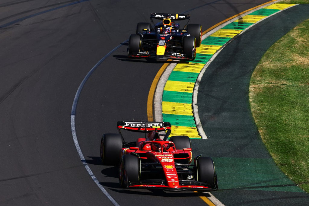 Carlos Sainz of Spain driving (55) the Ferrari SF-24 leads Max Verstappen of the Netherlands driving the (1) Oracle Red Bull Racing RB20 during the...