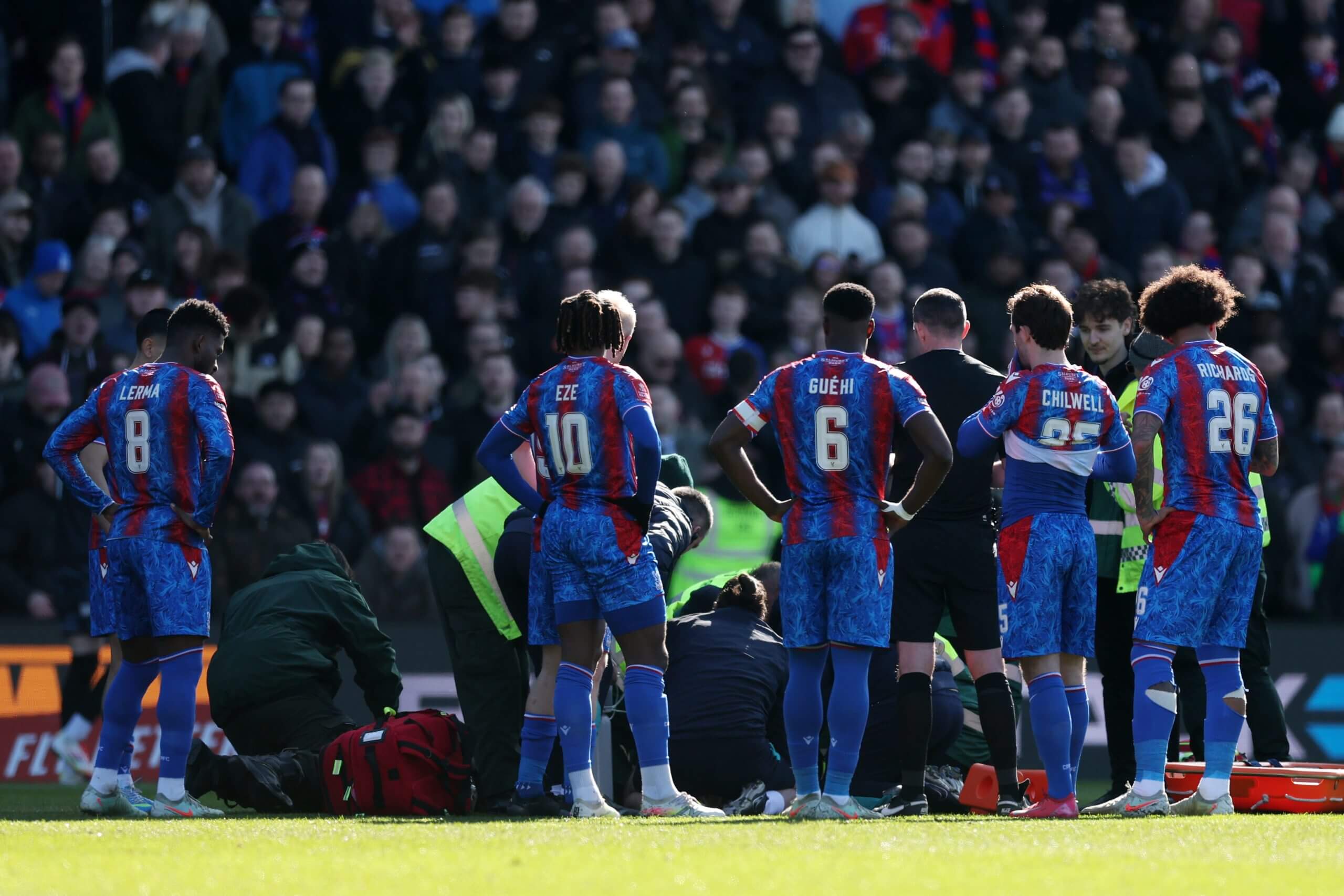 Mateta's team-mates looked on with concern as the striker received medical attention (Julian Finney/Getty Images)