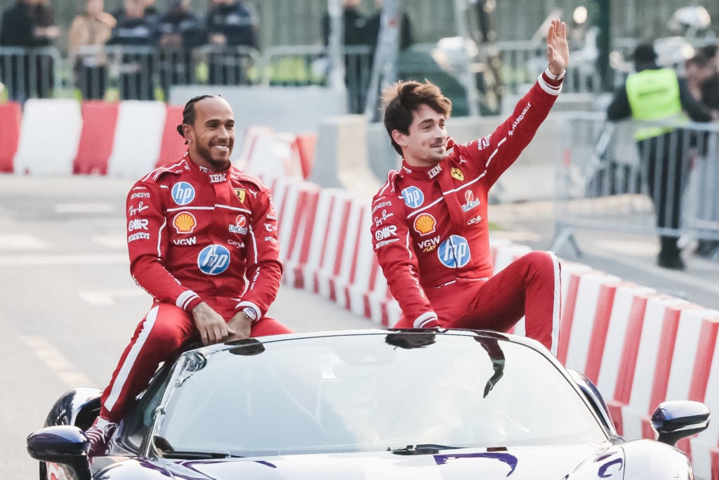 Lewis Hamilton and Charles Leclerc attend the street parade during the Scuderia Ferrari HP Drivers' Presentation by UniCredit event with a street d...