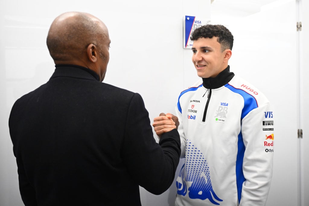 Anthony Hamilton with Isack Hadjar of France and Visa Cash App Racing Bulls in the garage during the F1 Grand Prix of Australia at Albert Park Gran...