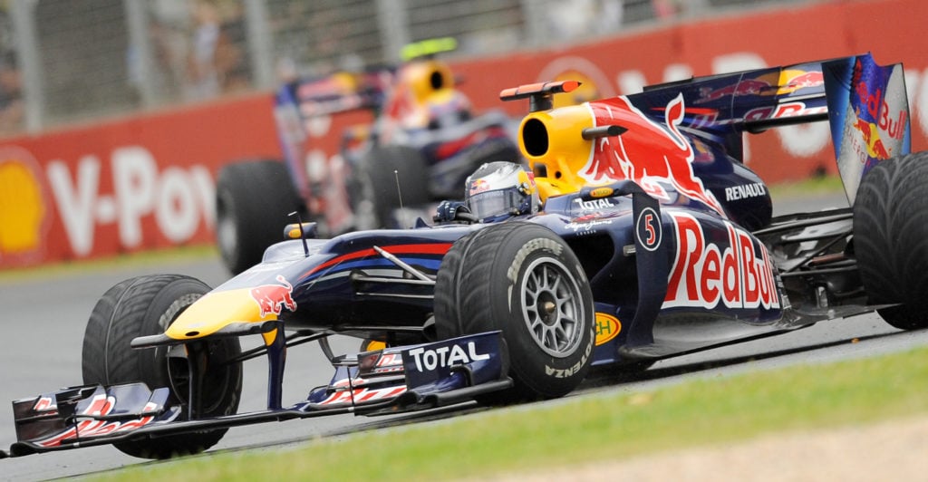 Red Bull-Renault driver Sebastien Vettel of Germany powers around a corner ahead of teammate Mark Webber of Australia during Formula One's Australi...