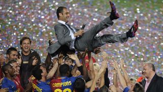 Barcelona players lift their coach Pep Guardiola in celebration of their Spanish league title 2009 after their Spanish League football match against Osasuna on May 23, 2009 at Camp Nou stadium in Barcelona. Barcelona became champions without even taking to the field as second-placed Real Madrid lost away at Villarreal on May 16.