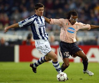 Xabi Alonso and Edgar Davids compete for the ball in a Champions League game between Real Sociedad and Juventus in November 2003.