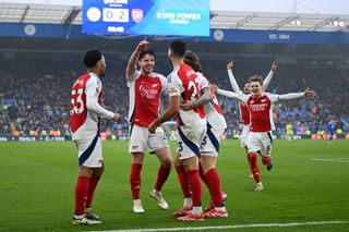 Mikel Merino of Arsenal celebrates scoring his team's second goal with teammates during the Premier League match between Leicester City FC and Arsenal FC at The King Power Stadium on February 15, 2025 in Leicester, England.