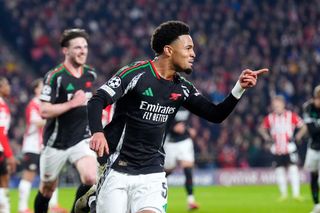 Ethan Nwaneri celebrates after scoring for Arsenal against PSV in the Champions League in March 2025.