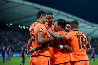 Philippe Coutinho celebrates with his Liverpool team-mates after scoring against Maribor in the Champions League in October 2017.