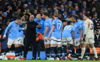 Manchester City manager Pep Guardiola gesticulates as he gives instructions to his players during the Premier League match against Liverpool at the Etihad Stadium on 23 February, 2025