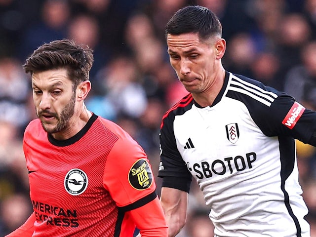 Brighton & Hove Albion's Adam Lallana in action with Fulham's Sasa Lukic on March 2, 2024.