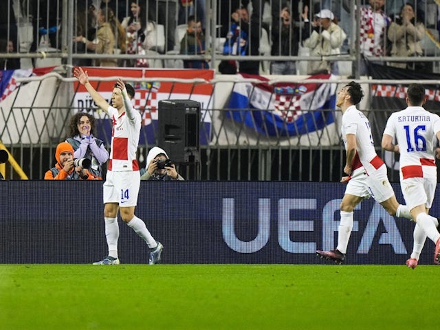 Ante Budimir of Croatia celebrates after scoring against France, on March 20, 2025