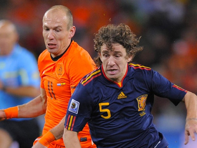 Netherlands' Arjen Robben in action with Spain's Carlos Puyol on July 11, 2010