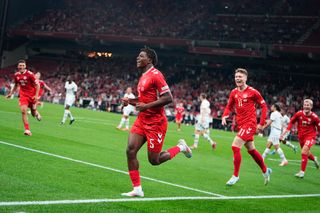 Denmark's defender #05 Patrick Dorgu (C) celebrates scoring the 1-0 opening goal during the UEFA Nations League football match League A, Group A4, Day 1, Denmark v Switzerland in the Parken stadium in Copenhagen, Denmark, on September 5, 2024. (Photo by Mads Claus Rasmussen / Ritzau Scanpix / AFP) / Denmark OUT (Photo by MADS CLAUS RASMUSSEN/Ritzau Scanpix/AFP via Getty Images)