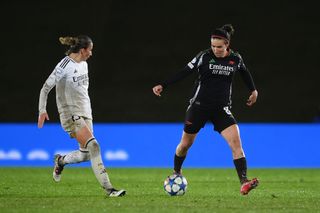 Mariona Caldentey of Arsenal runs with the ball under pressure from Sheila Garcia of Real Madrid during the UEFA Women's Champions League Quarter Finals First Leg match between Real Madrid CF and Arsenal FC at Estadio Alfredo Di Stefano on March 18, 2025 in Madrid, Spain.